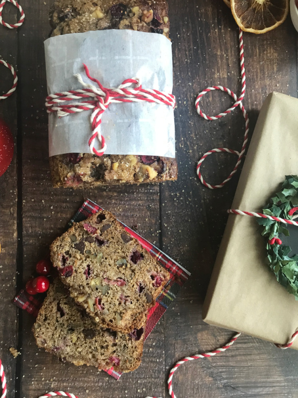 Cranberry apple bread wrapped in paper and ties with red twine.