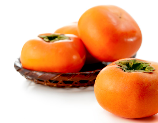 persimmons in a bowl. 