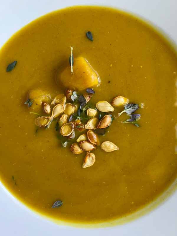 roasted butternut squash soup with seeds and thyme.