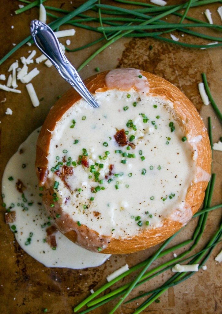 Beer Cheese Soup in a round bread loaf. 