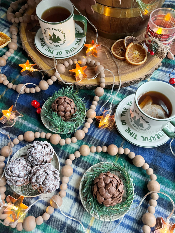 two cups of tea and brownie cones.