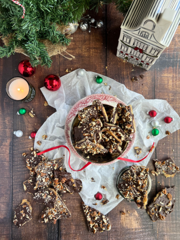 Bourbon Christmas crack with ritz crackers and pecans flatlay.
