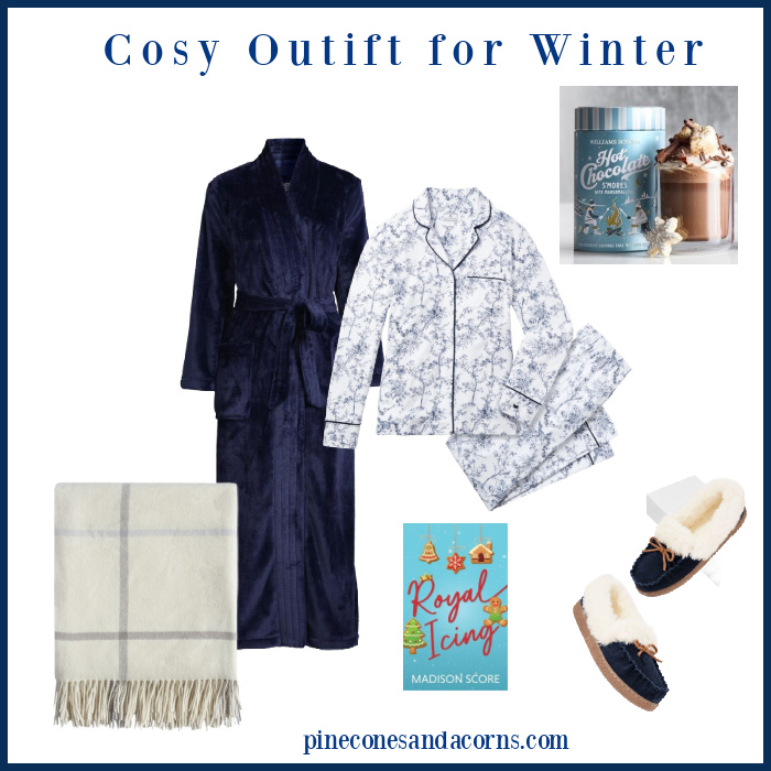Cosy winter pajamas and robe with book and hot chocolate.