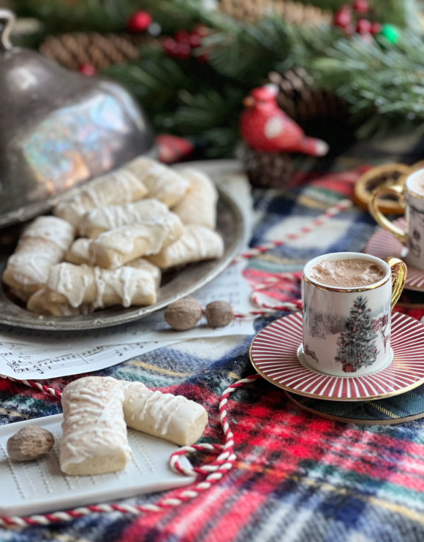 Nutmeg log cookies and a cup of hot chocolate.