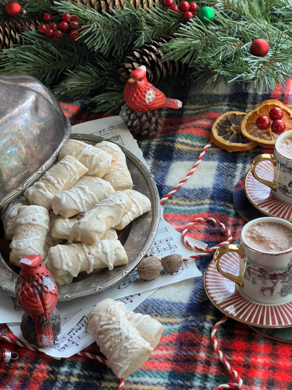 Nutmeg log cookies on a silver platter.