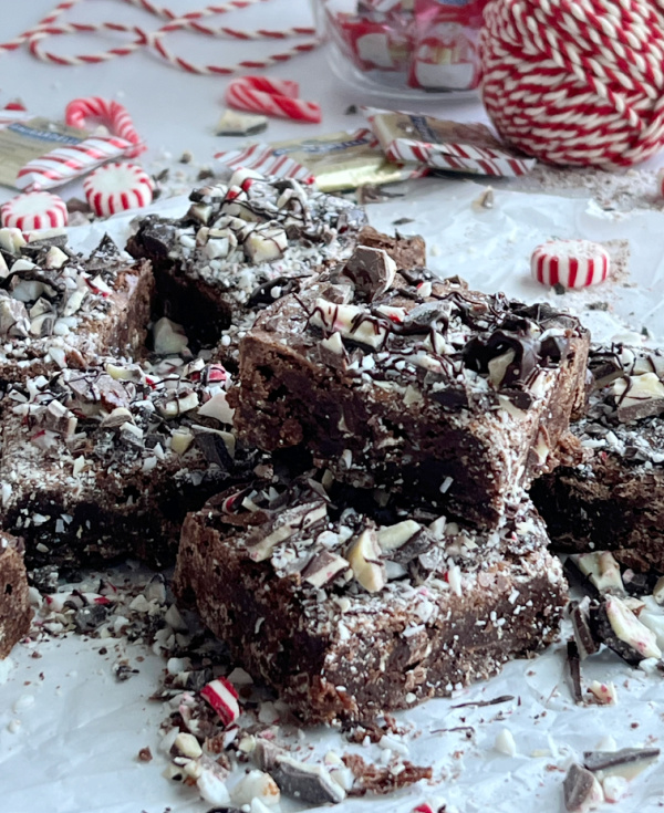 Peppermint Bark Brownies with scattered candy and red and white twine.