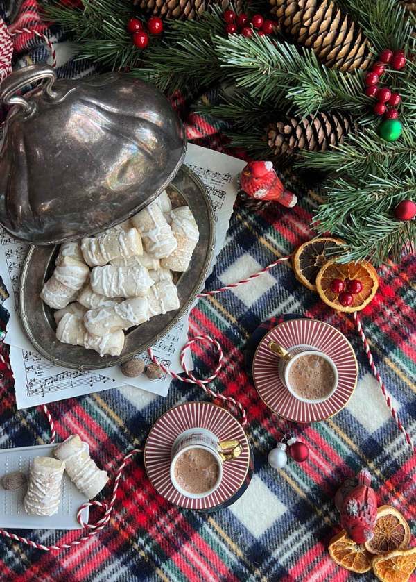 christmas cookie flatlay with plaid blanket, cookies, birds.