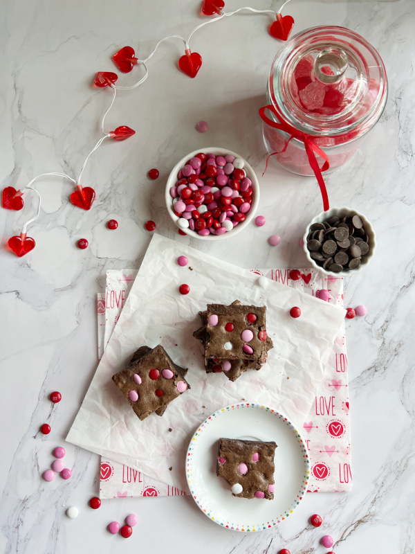 Valentine's M&M Fudge Brownies and a jar of candy hearts.