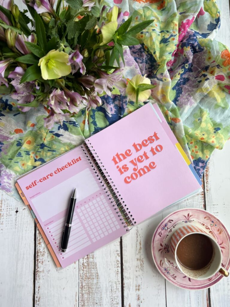 Dear woman who has been last on her own list — a quiet morning moment with a cup of hot chocolate, flowers and journal.