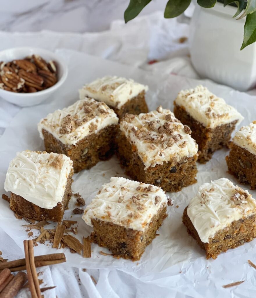 Sliced carrot cake with pecans.
