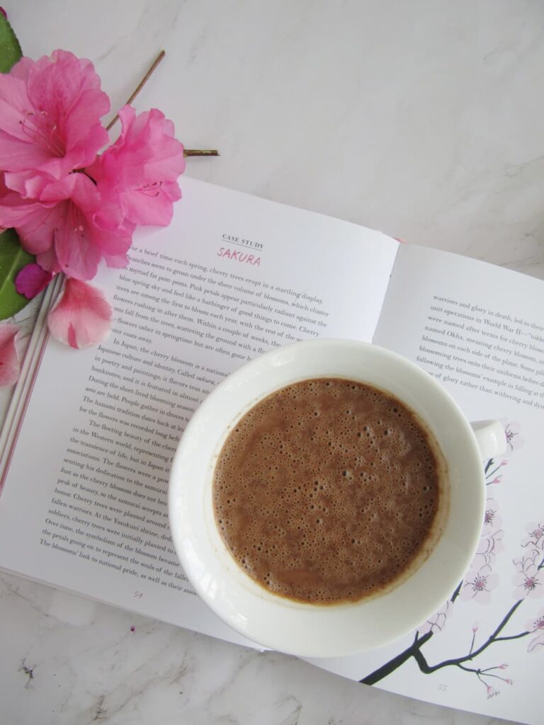 You have earned this — a beautiful cup of drinking chocolate and fresh flowers as a daily act of self care for women over 50.