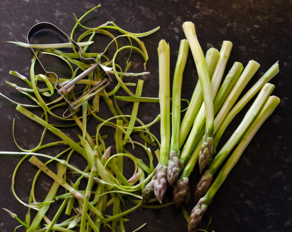 shaved asparagus and a vegetable peeler. 