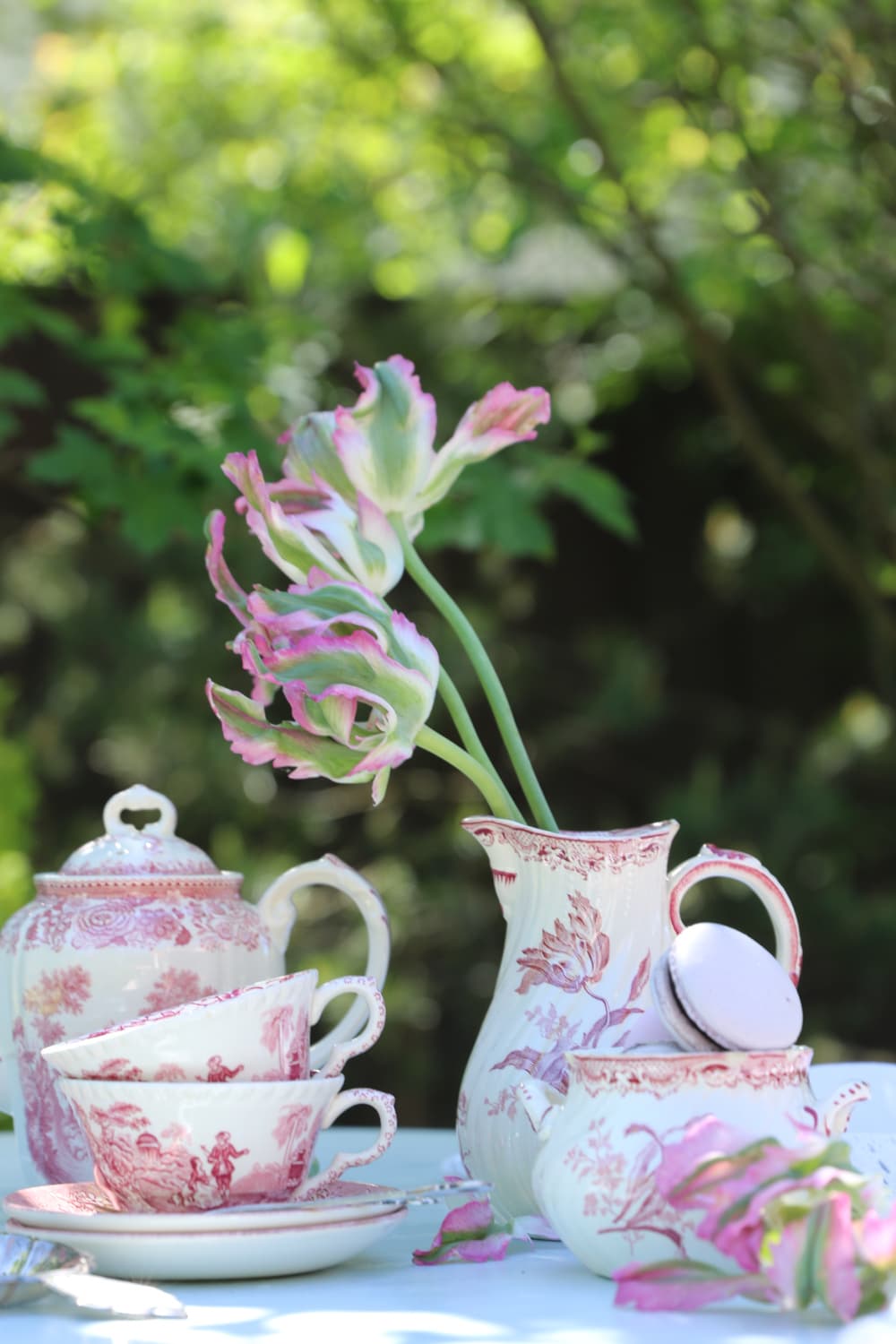 Recipes for entertaining — a beautifully set table with cups, saucers and seasonal flowers