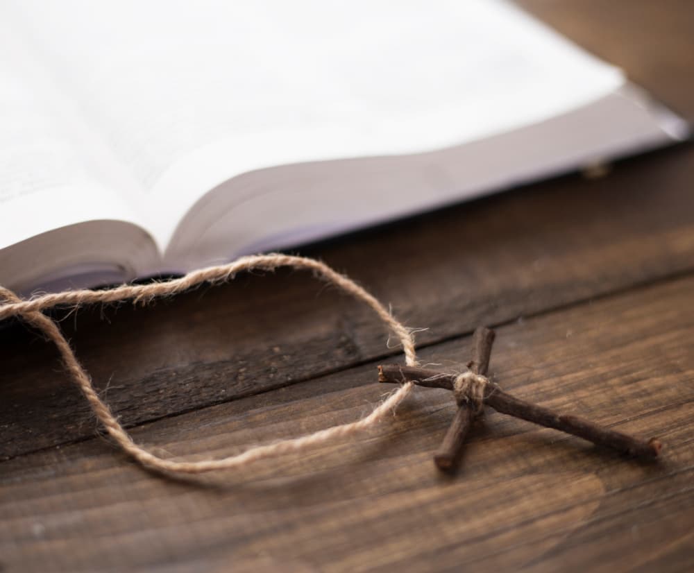 Easter faith — an open missal with a small cross, the moment of grace on a Sunday morning ten days later