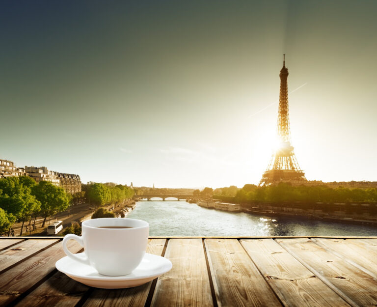 Cup of coffee with the Eiffel Tower in the background