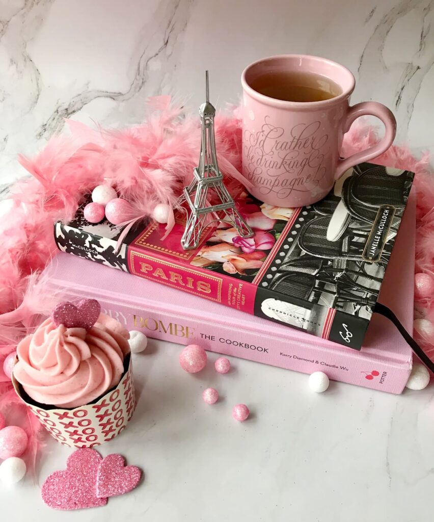 Books for women over 50 — Paris Book and a cookbook with cupcake and a cup of tea