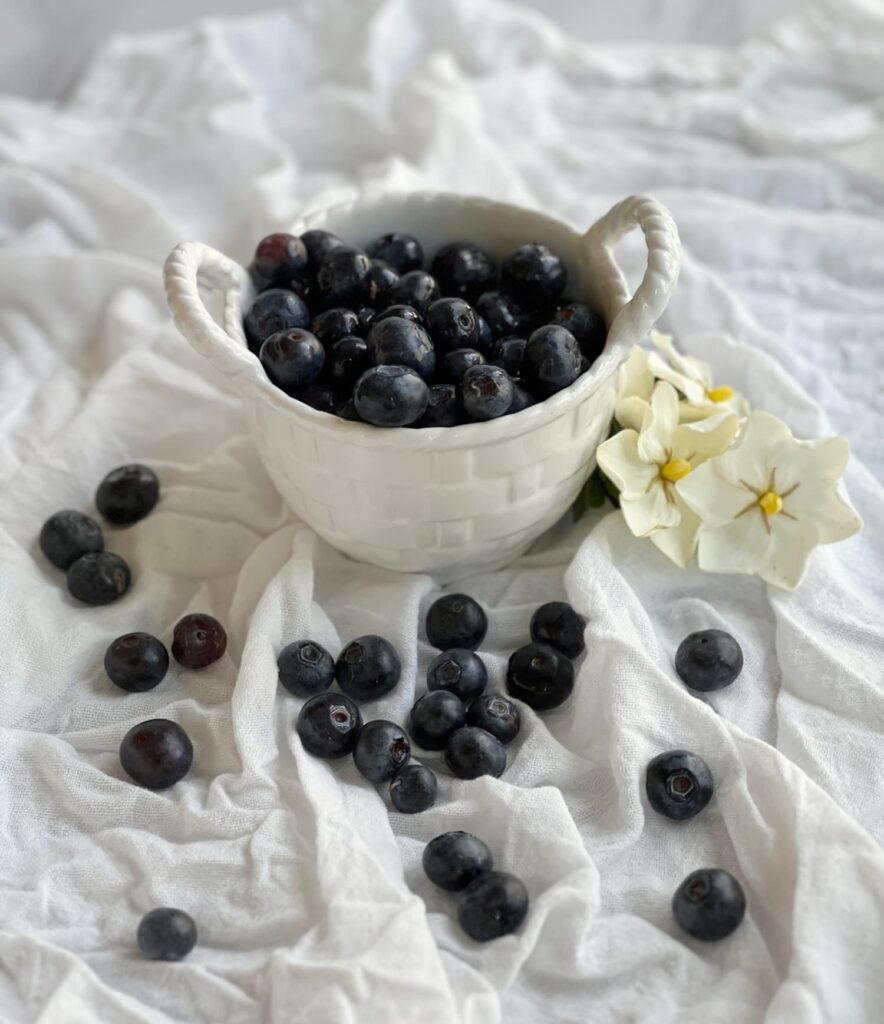 White basketweave bowl filled with blueberries