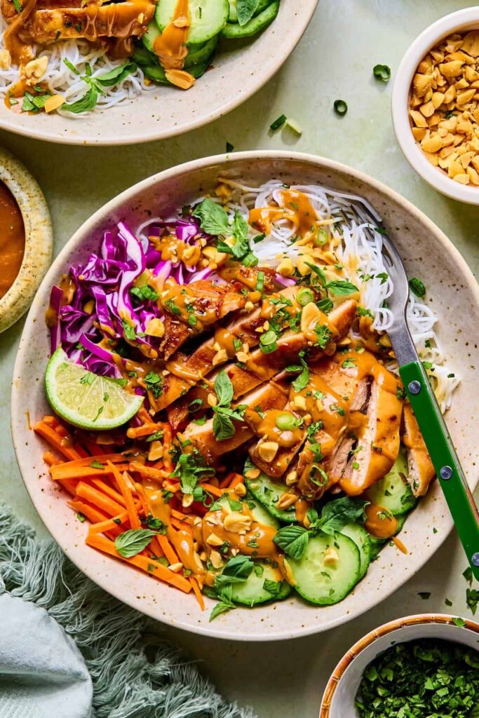 Spring roll bowls with peanut sauce and fresh herbs