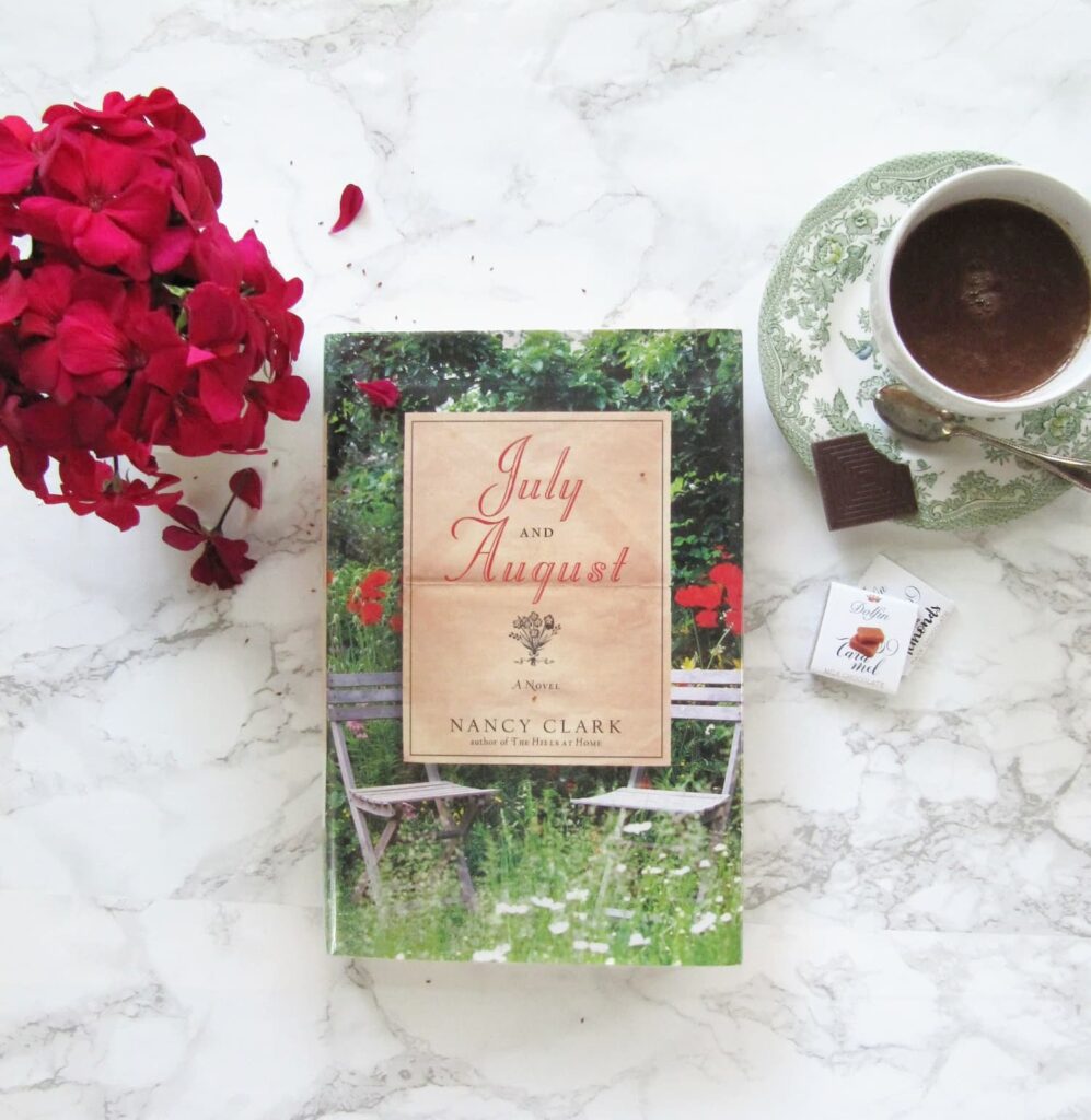 flowers, book and a cup of hot chocolate