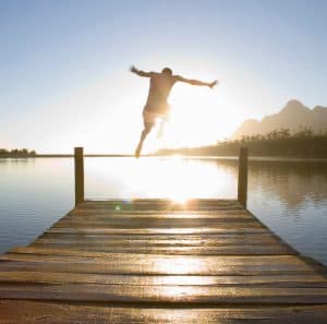 summer-fun-jumping-off-the-dock-300x297