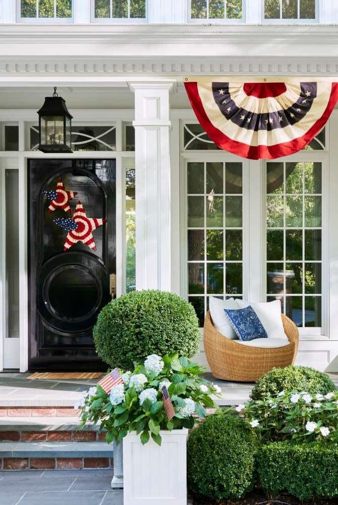 cottage decorated with American flags and bunting for the 250th birthday of America