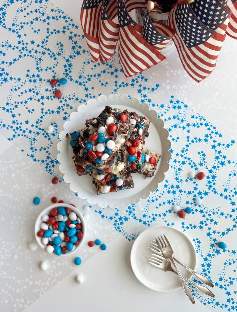 red white and blue magic cookie bars on a platter