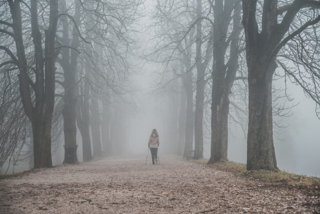 Woman walking in the mist of menopause