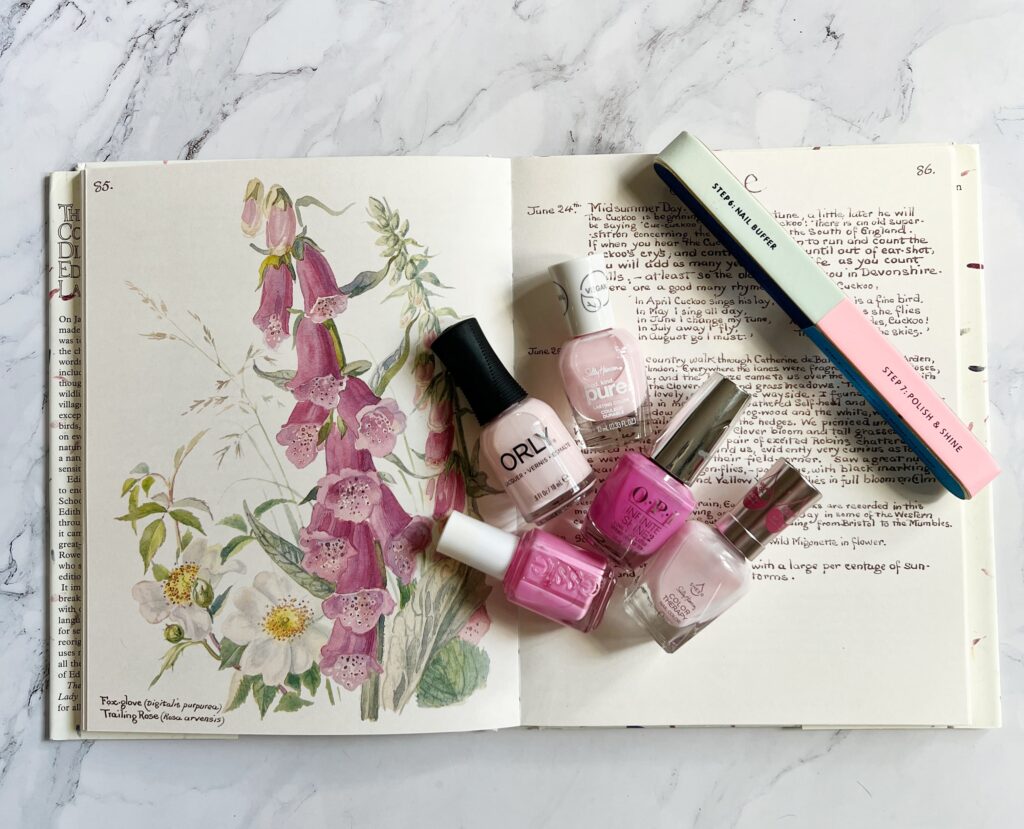 summer nail colors for women, classic pale pink and vibrant toe polish flat lay with a book