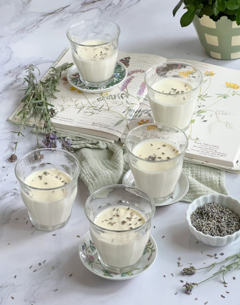 Lavender panna cotta in glasses topped with dried lavender buds