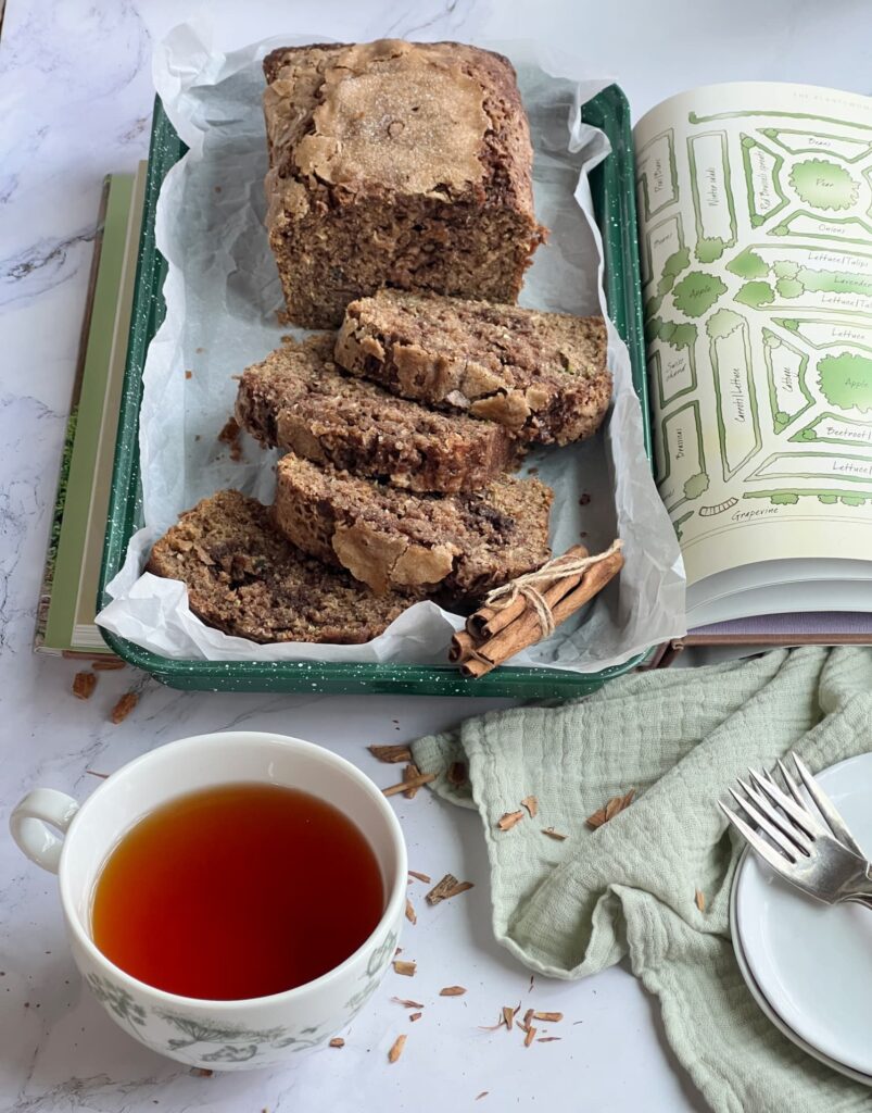 Cinnamon swirl zucchini bread with a cup of tea