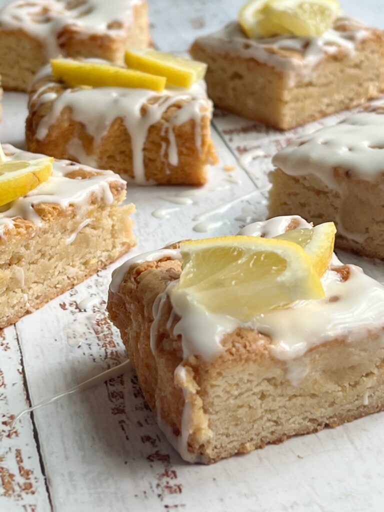 Lemon blondies with lemon glaze and lemon slices.