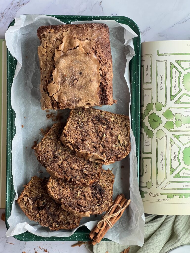 Zucchini bread sliced on a green tray