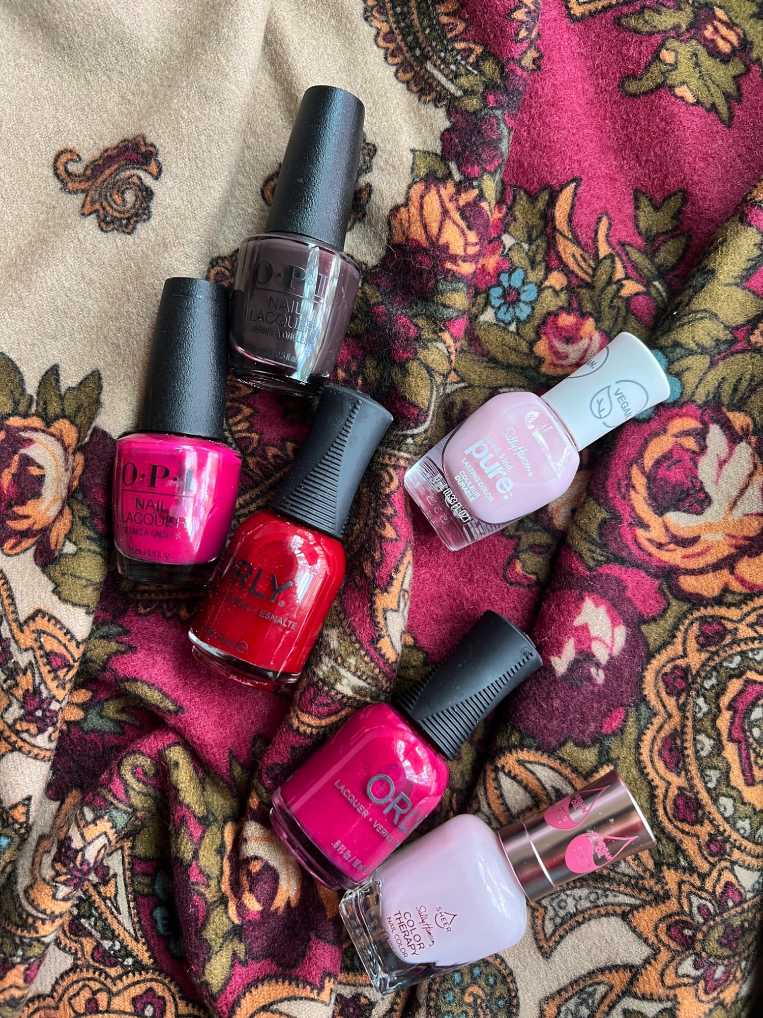 fall nail polish on a fall paisley scarf