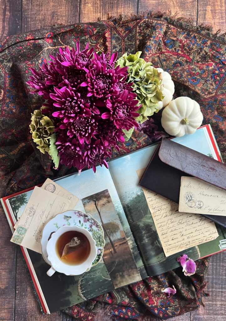 Fall Flatlay with flowers, cup of tea and book