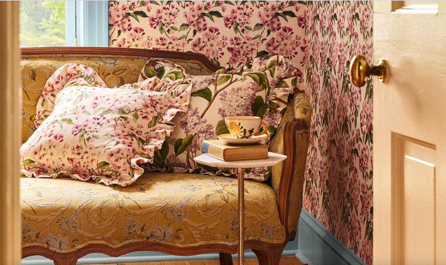 Green Row Love Seat and flower pillows and wallpaper