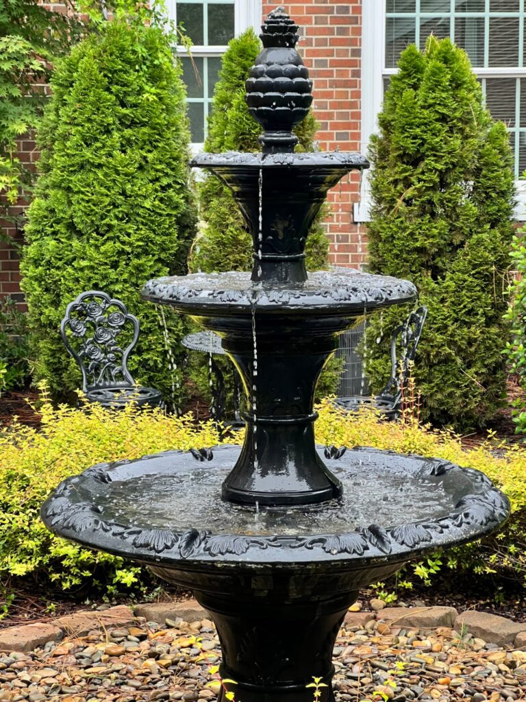 Monday Musings black fountain with pineapple finial