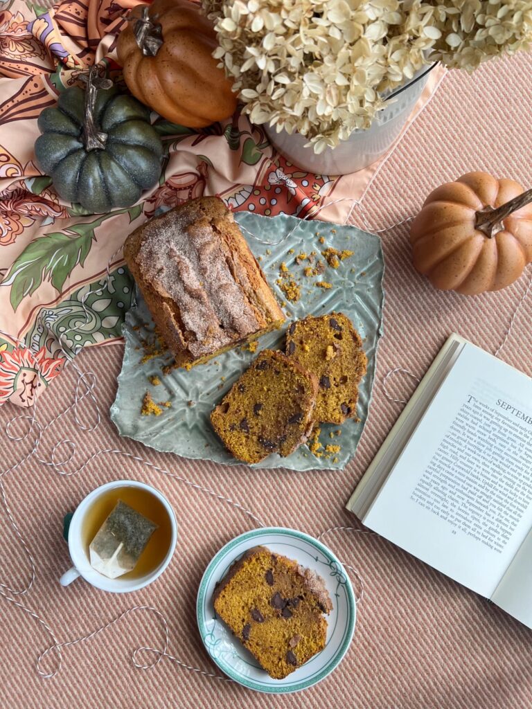 chocolate chip pumpkin bread sliced on a green tray