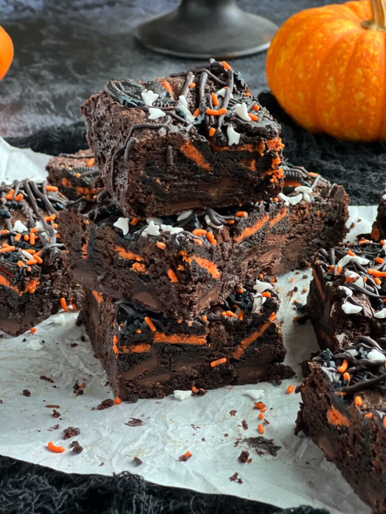 Halloween Oreo brownies cut into squares with chocolate drizzle